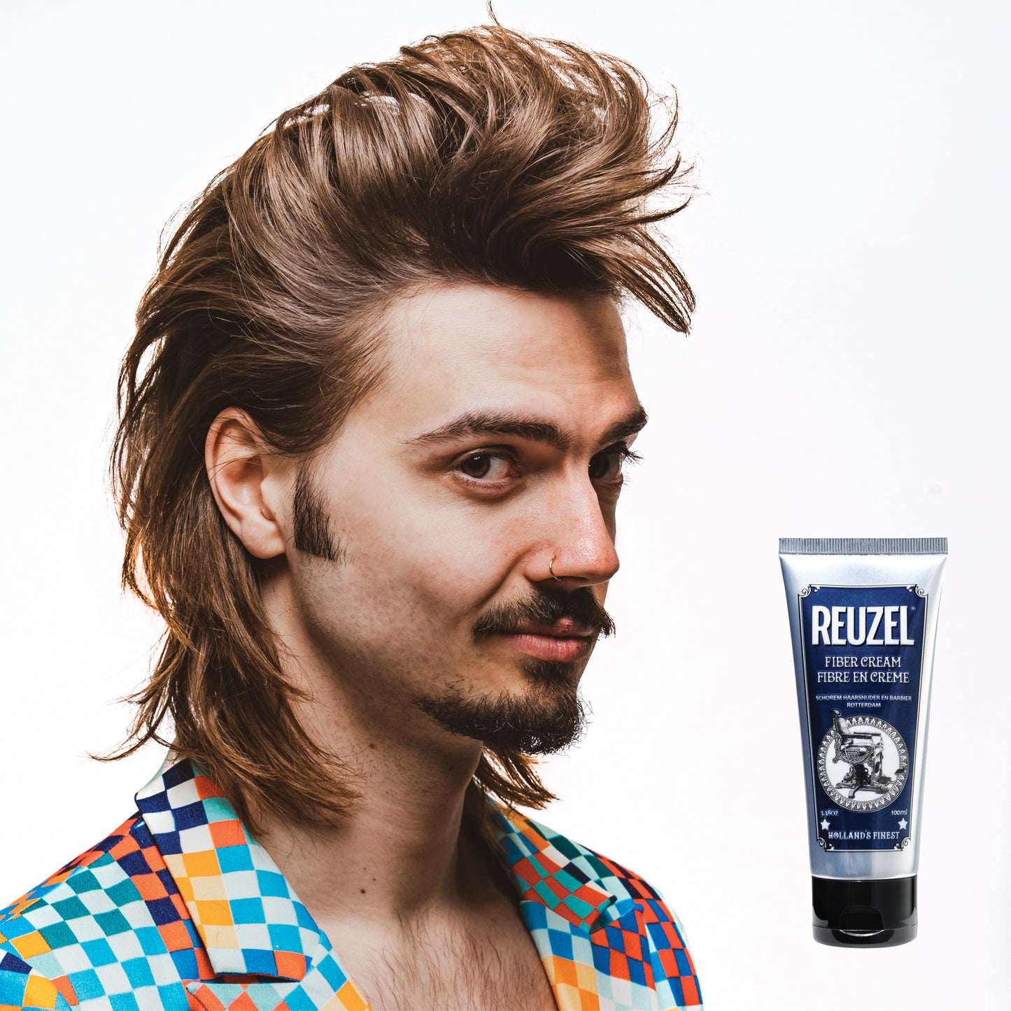 Reuzel Fiber Cream hair styling product in a jar, showing the creamy texture and packaging on a clean background