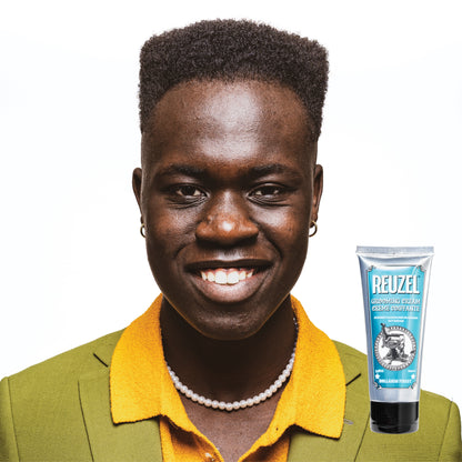 Reuzel grooming cream for hair styling, showing a jar of grooming cream with a textured finish and branding on the label.