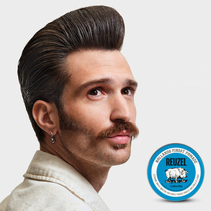 Reuzel Road Trip To Go Blue Pomade jar with blue label and lid, showcasing the hair styling pomade product.