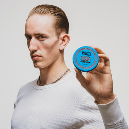 Reuzel Blue Pomade jar for classic styling, featuring a blue lid and label, ideal for adding shine and hold to hair.