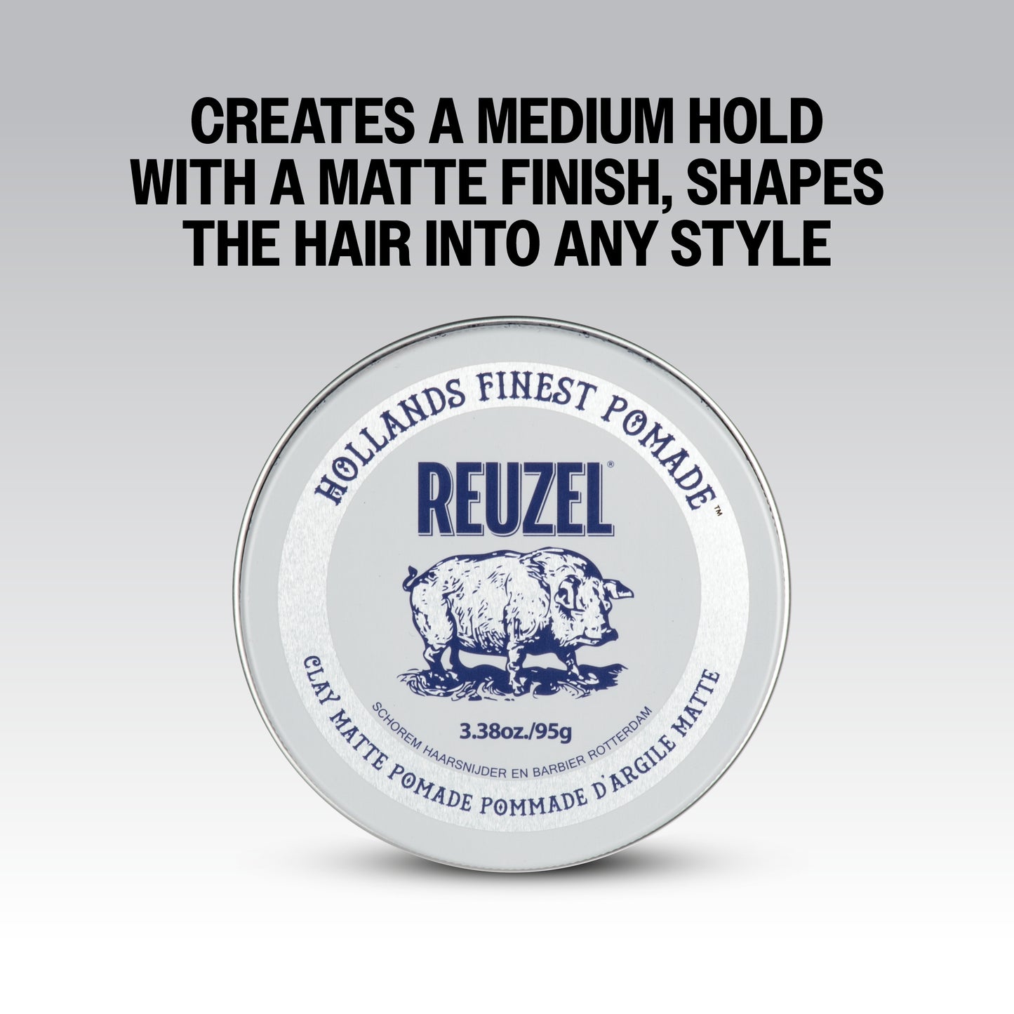 Reuzel Road Trip To Go Clay Pomade jar with black lid and label, showing the product container for styling hair.