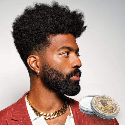 Reuzel Beard Balm Wood & Spice in a small jar, showcasing natural ingredients and a warm, woody scent for grooming and styling.