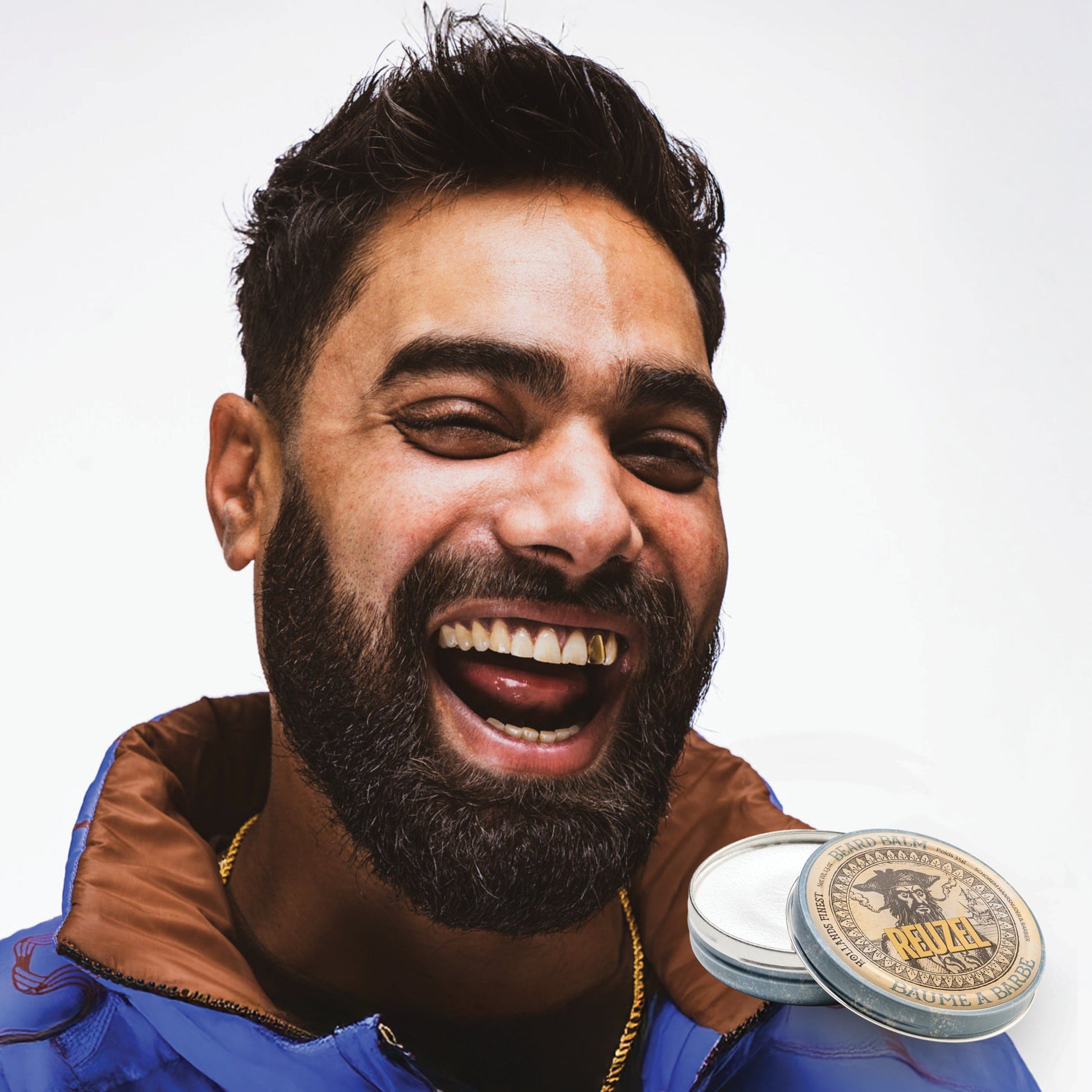 Reuzel Beard Balm Wood & Spice in a jar with ingredients and application instructions visible on the packaging.